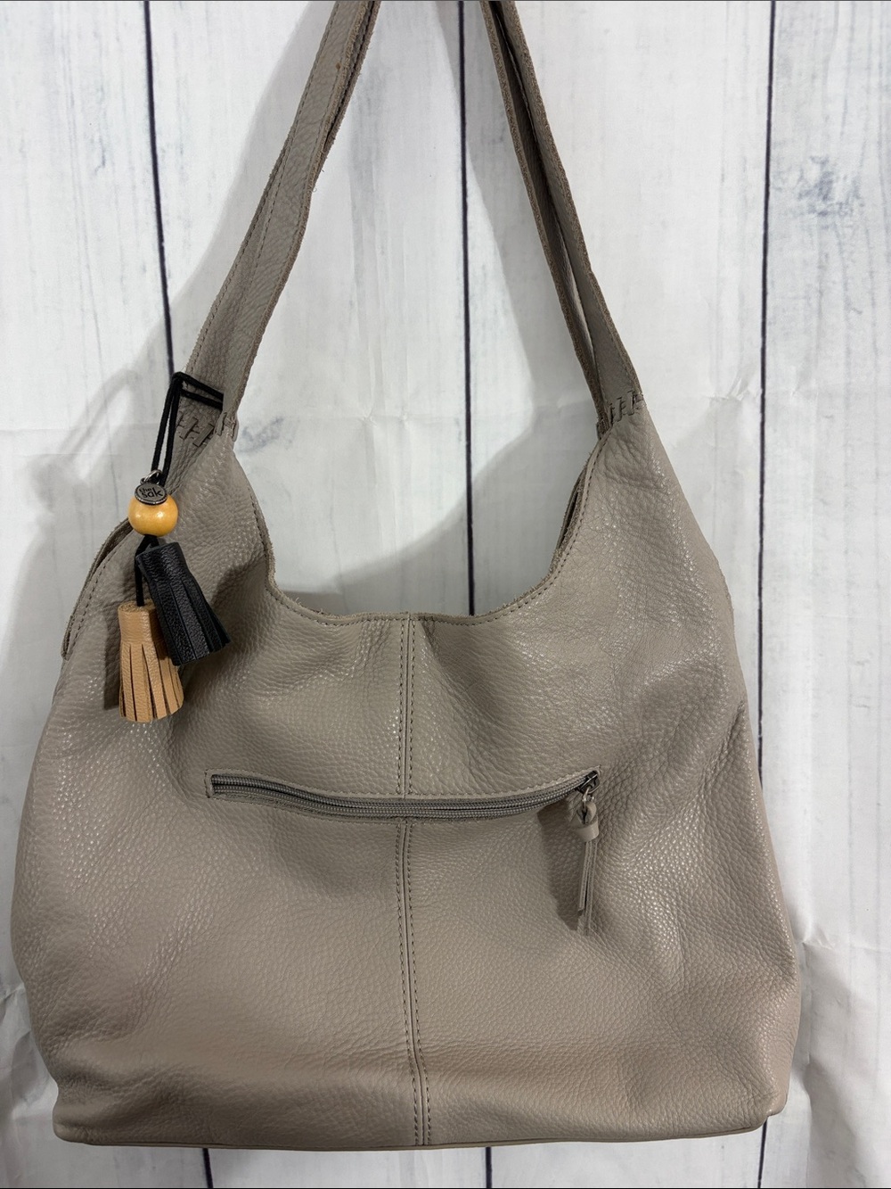 The Sak Taupe Leather Hobo Shoulder Bag with Tassel Charm